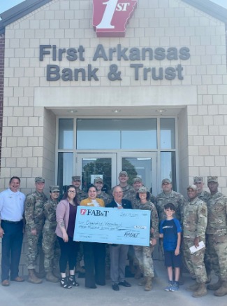 Staff and Military Personnel in front of the bank