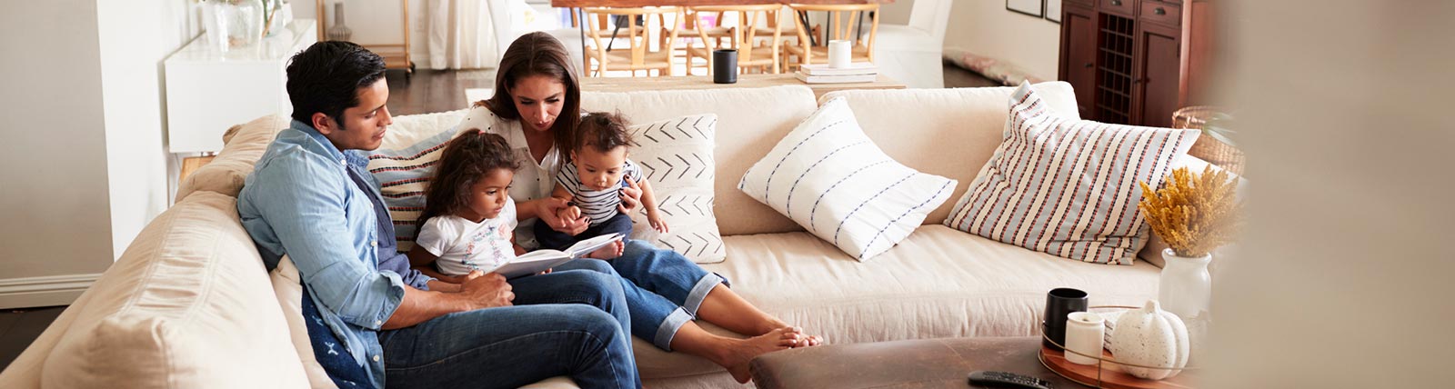 Young family sitting in living room